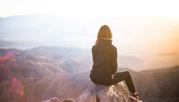 girl-at-top-of-mountain